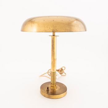 A brass table lamp possibly by Bertil Brisborg, from the mid 20th century.