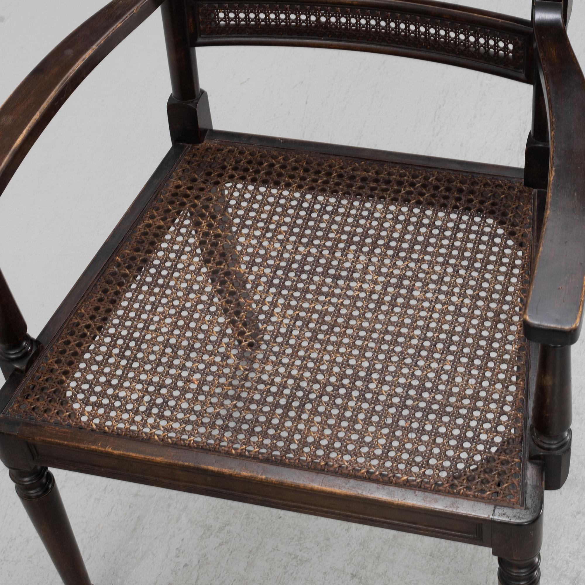 A pair of stained birch armchairs, and a pair of chairs, 'Harding' Nordiska Kompaniet, first half of the 20th Century.