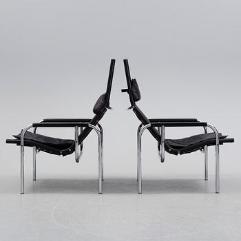 A pair of easy chairs and ottoman, designed by Hans Eichenberger, Strässle, Switzerland.