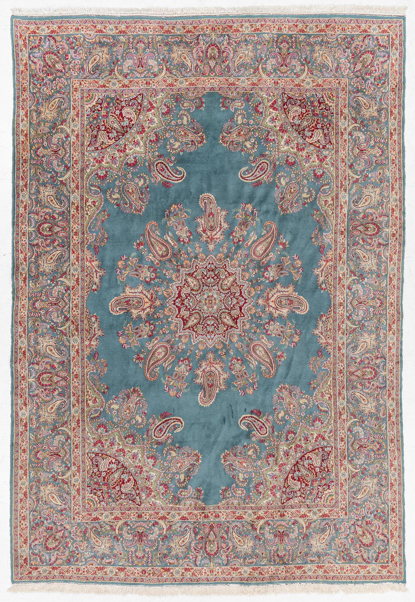 A Kirman carpet, c. 335 x 232 cm.