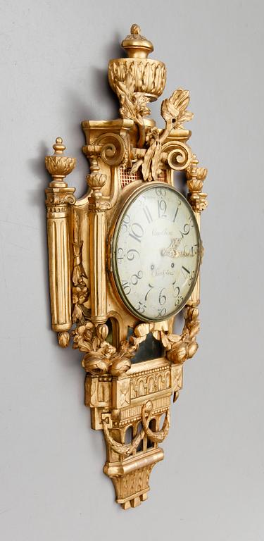 A Gustavian wall clock by Claes Berg, master 1762.