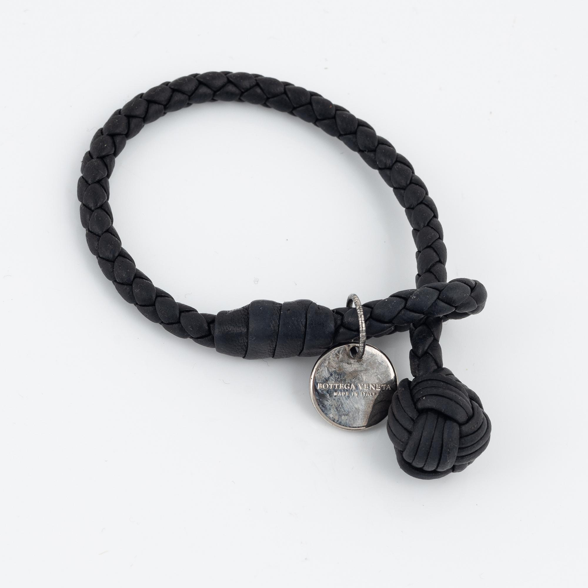 Bottega Veneta, a wallet and bracelet.