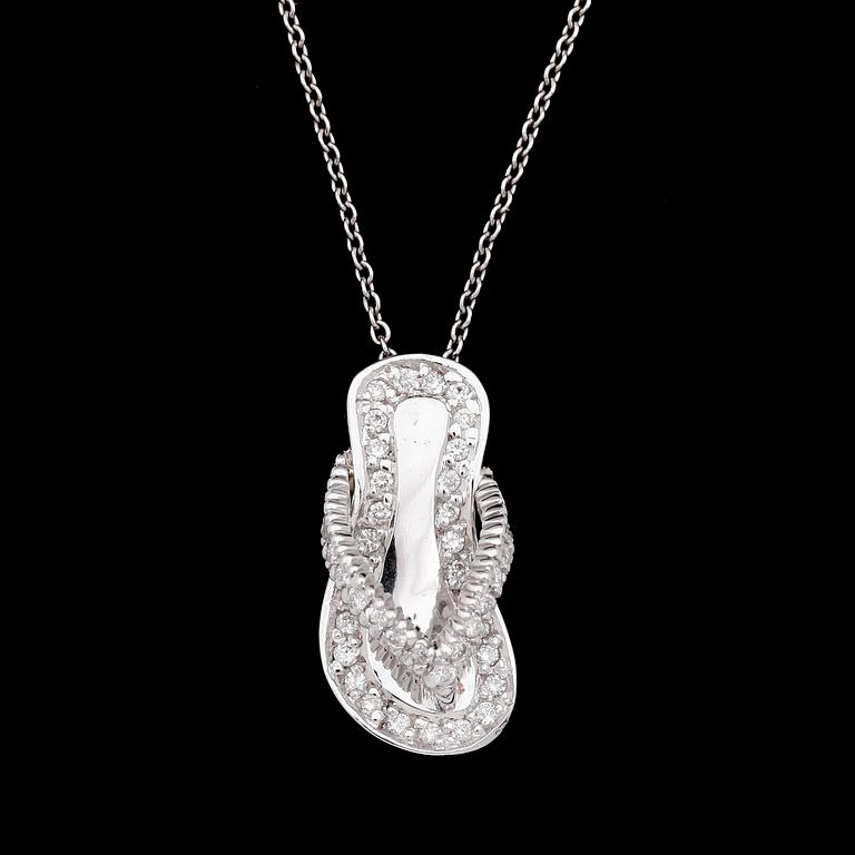 PENDANT, shape of small sandal, brilliant cut diamonds, tot. app. 0.45 ct, underneath small ruby.