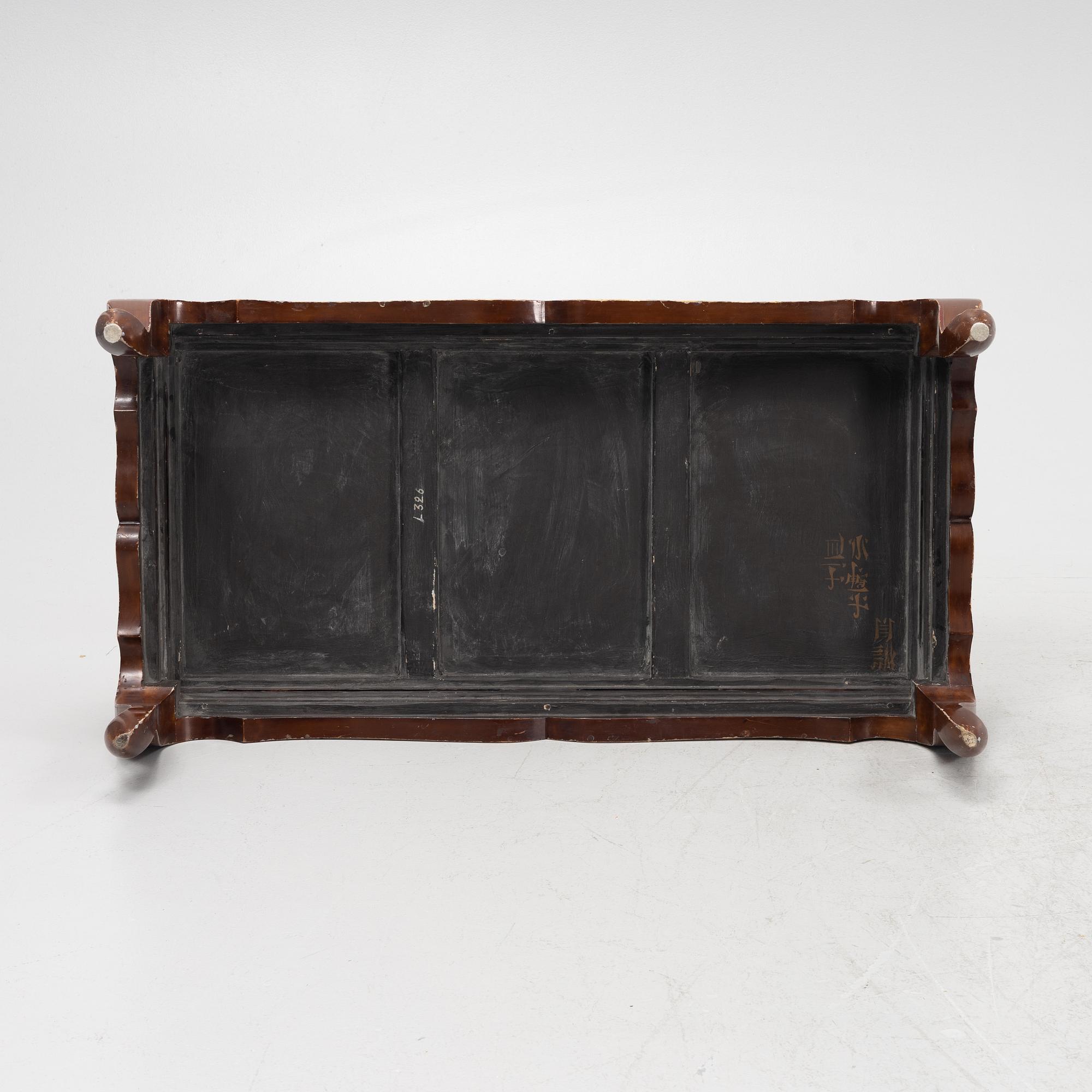 A Chinese lacuered kang table, second half of the 20th century.