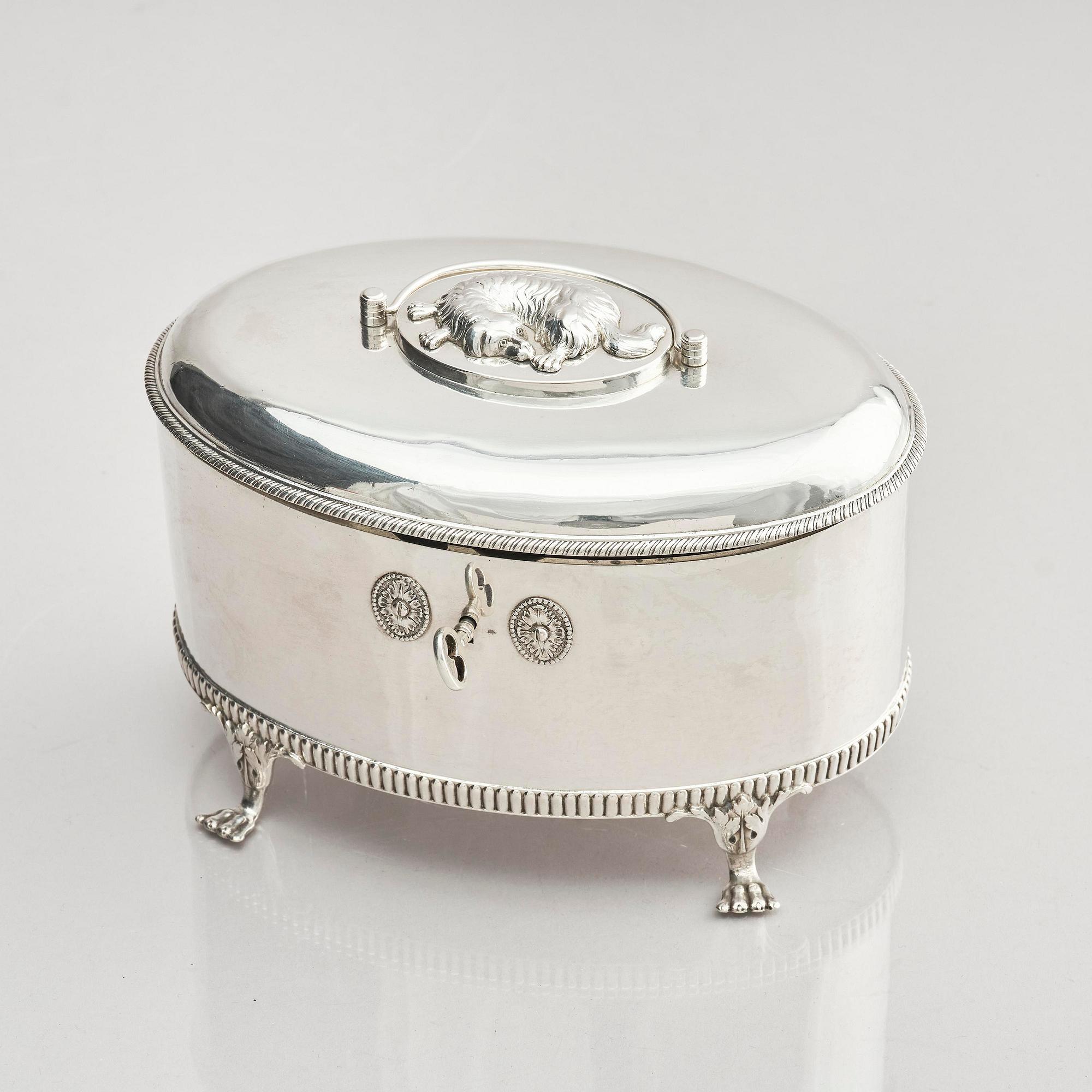 A Swedish 19th century silver sugar-casket and tong, marks of Adolf Zethelius, Stockholm 1819.