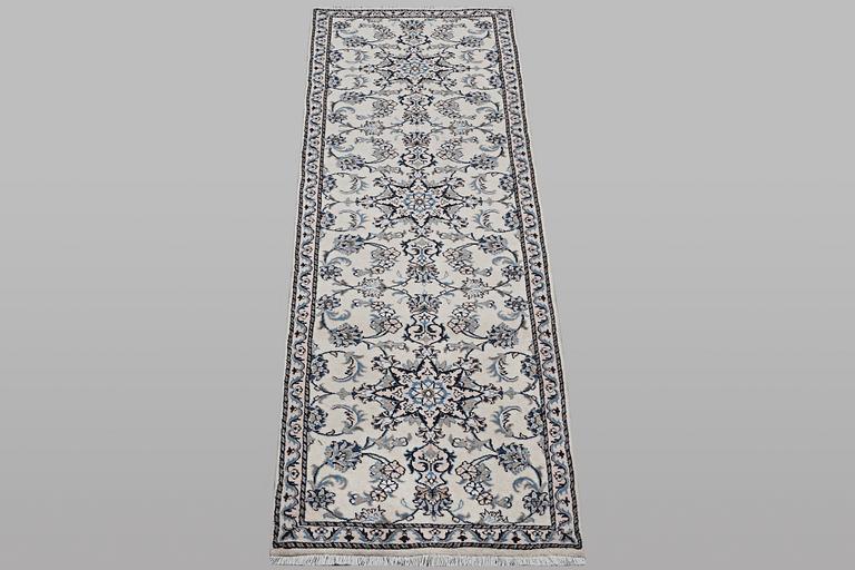 A runner carpet, Nain, part silk, ca 289 x 79 cm.
