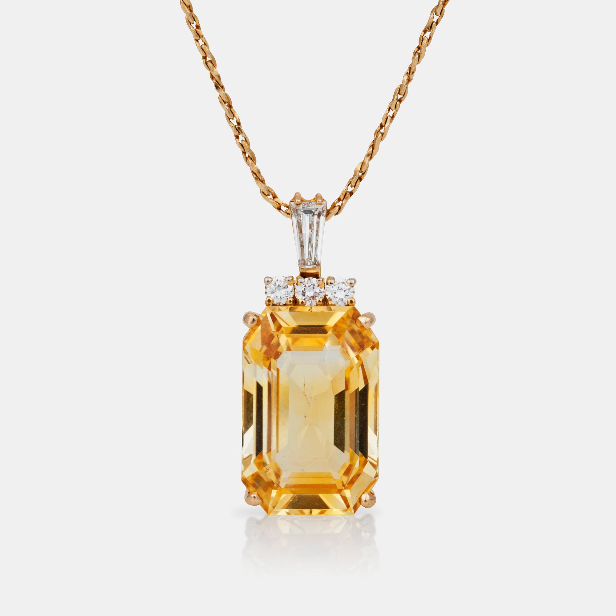 An unheated 14.80 ct fancy yellow sapphire and diamond pendant. Certificate from SSEF.