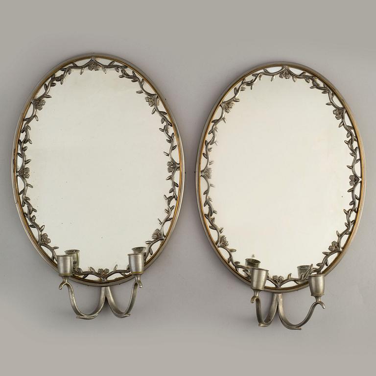 A pair of pewter wall sconces, Firma Svenskt Tenn, model no 245, Stockholm 1928.