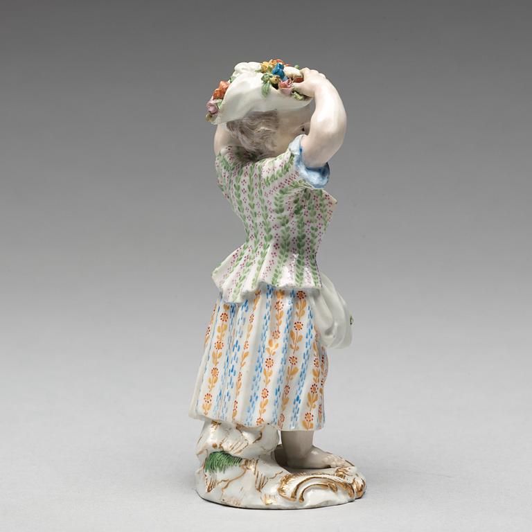 A Meissen figure of a girl with flowers, 1890's.