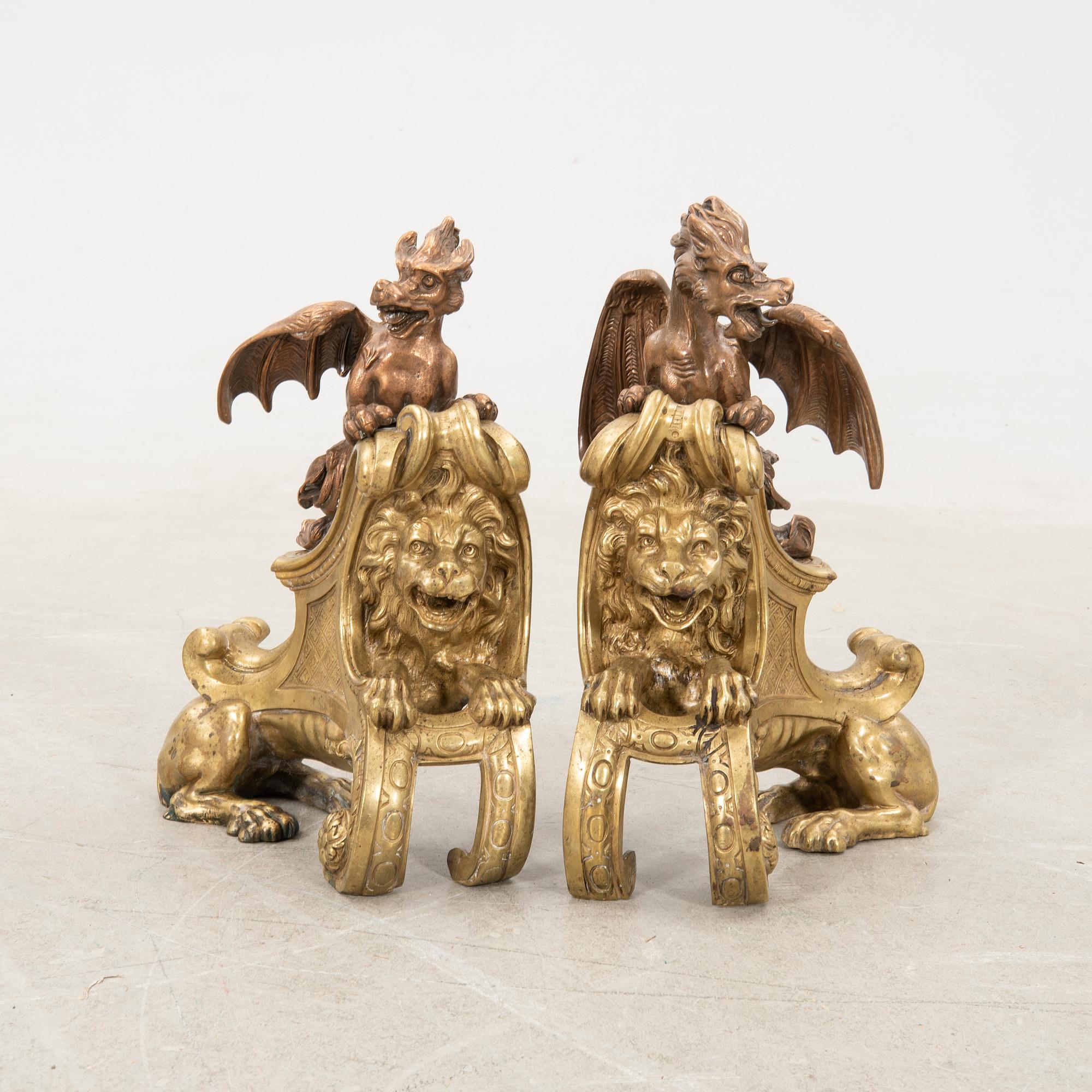Fire dogs a pair of Baroque style 20th century in the manner of Charles Cressent.