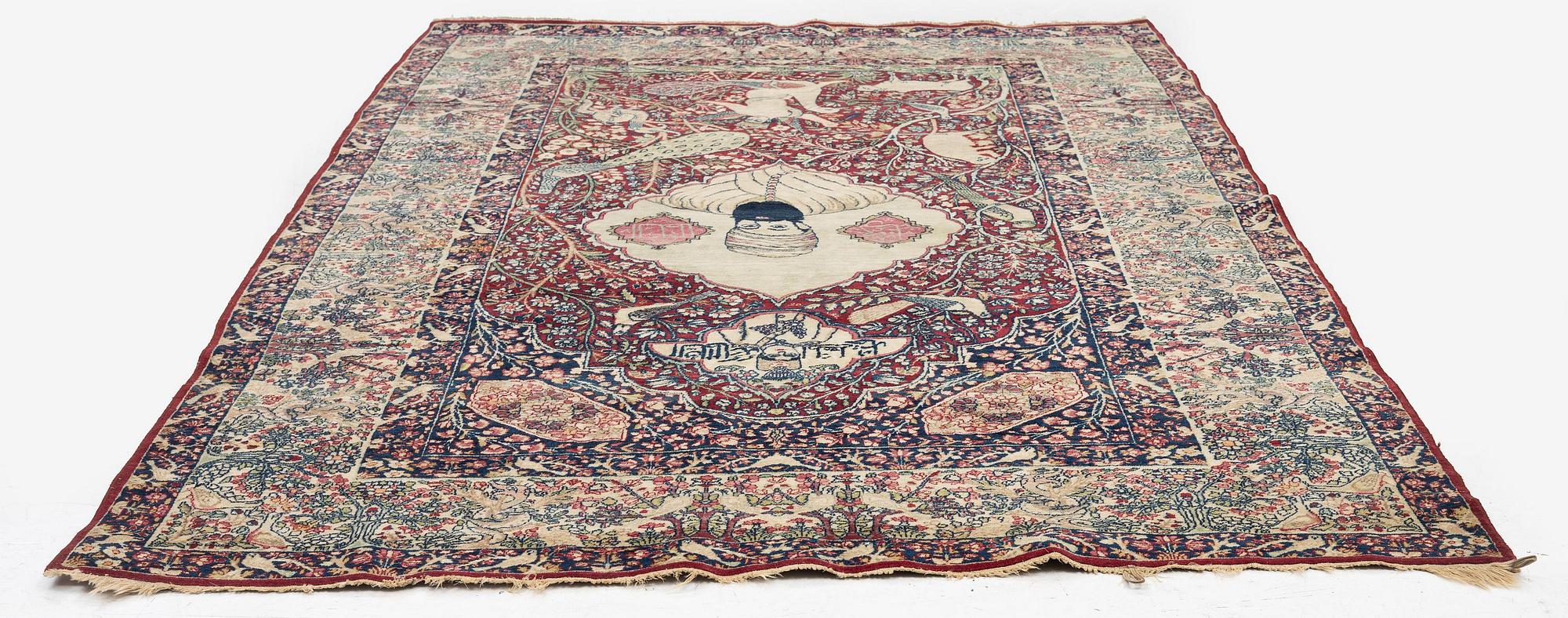 An antique Kirman Laver figural, Southeastern Iran, c. 220 x 135 cm.
