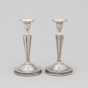 A pair of silver candle sticks by Eric Löfman, Uppsala 1976.