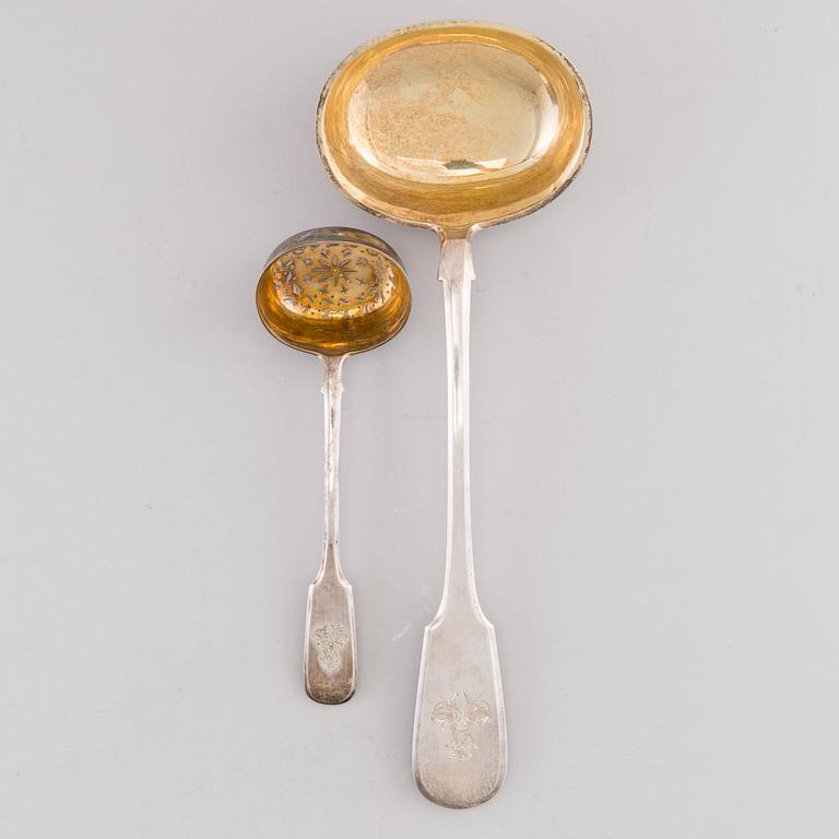 A Russian silver soup ladle and sugar caster by Sasikov, Saint Petersburg 1869.