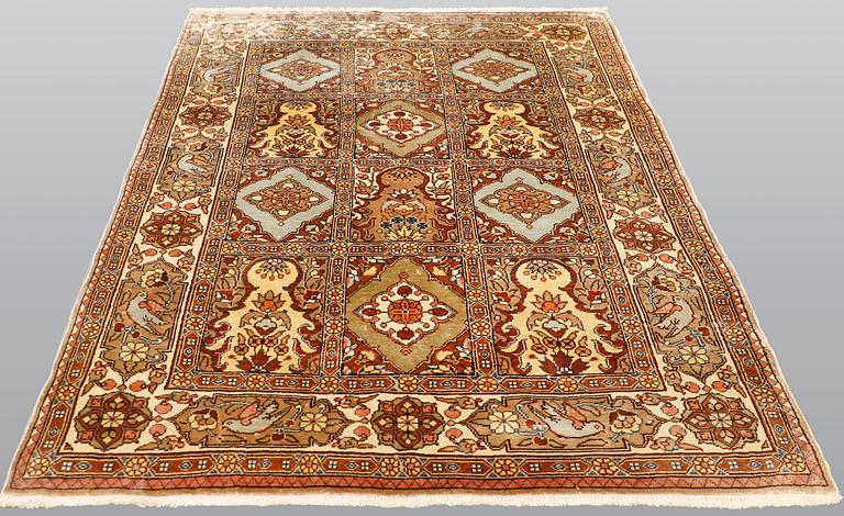 A semi-antique figural Kaysari silk carpet, approx. 100 x 70 cm.