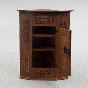 Corner cabinet, dated 1769.
