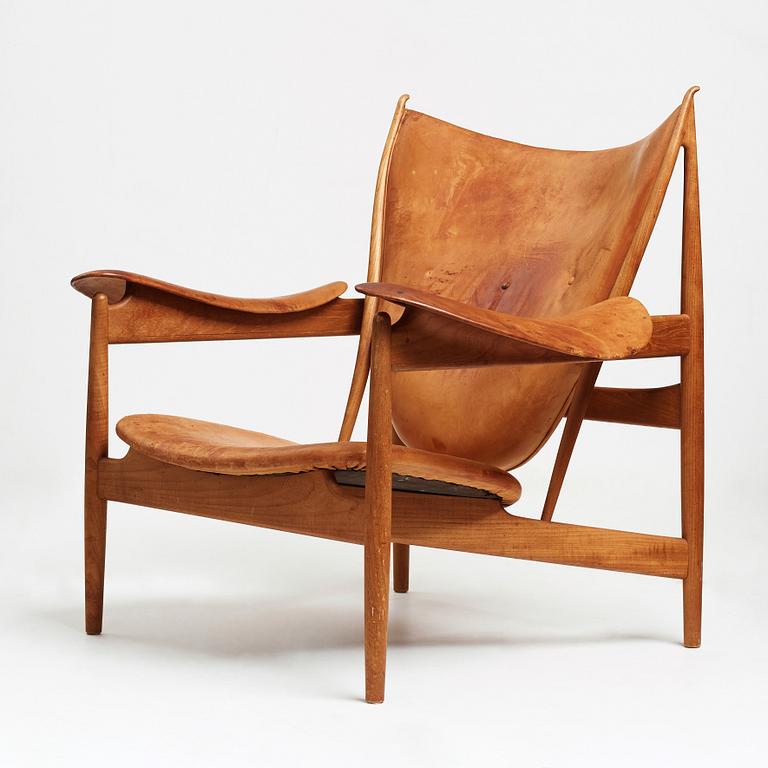 Finn Juhl, a teak and natural brown leather "Chieftain Chair" by Niels Vodder, 1950-60's.