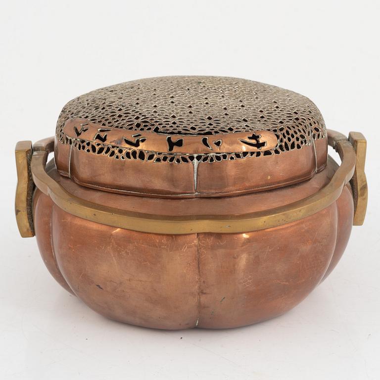 A Chinese copper handwarmer, late Qing dynasty.