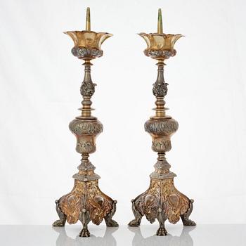 Four Italian 17th/18th century silver-gilt candlesticks, unidentfied makers mark ZP, Venice.