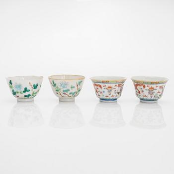 A set of seven bowls of which three with lids and a small famille rose jar, including Guangxu mark, China, circa 1900.