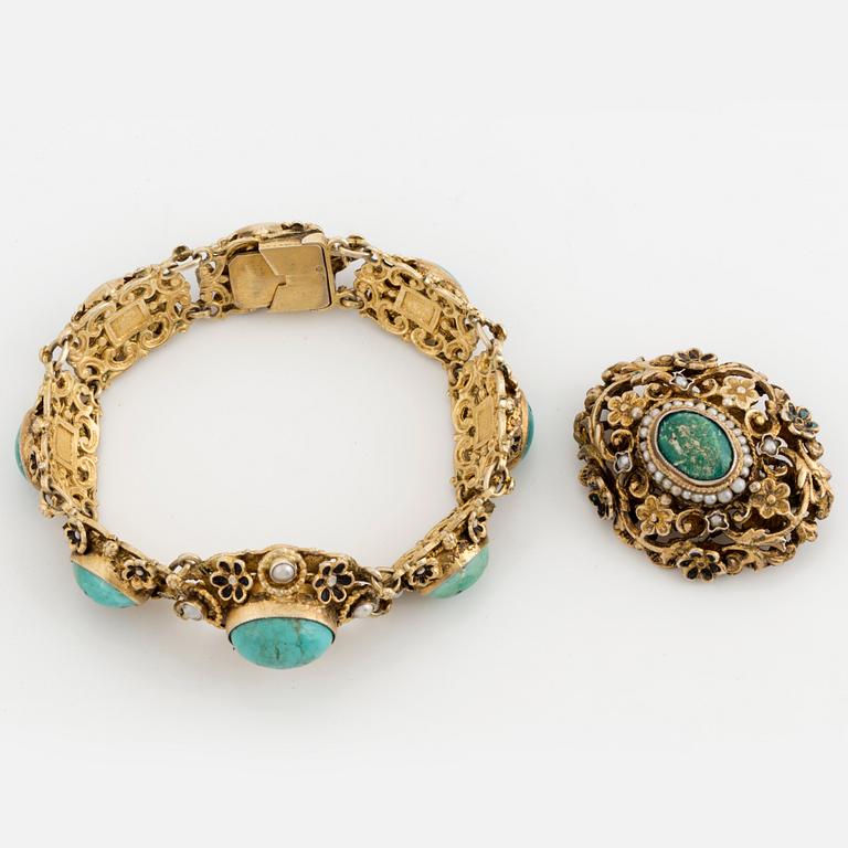 A cabochon cut turquoise and cultured pearl bracelet and brooch.