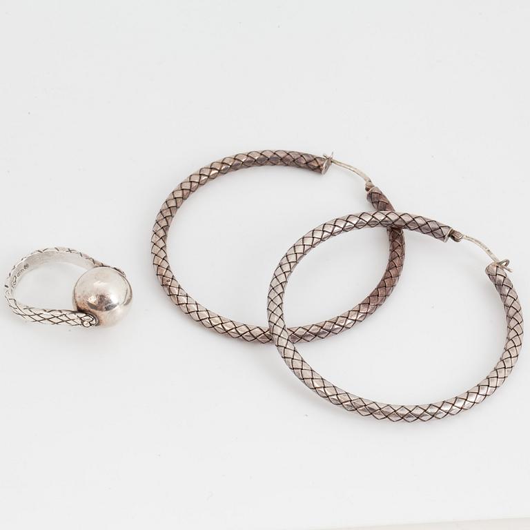 BOTTEGA VENETA, a pair of silver earrings and a silver ring.