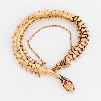 A 14K gold bracelet with diamonds and ruby.