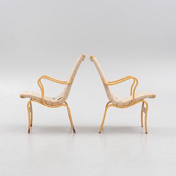 Bruno Mathsson, a pir of 'Eva' armchairs, Dux, late 20th century.
