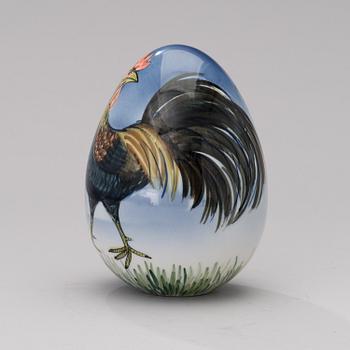 A porcelain egg signed GOG Arabia Finland.
