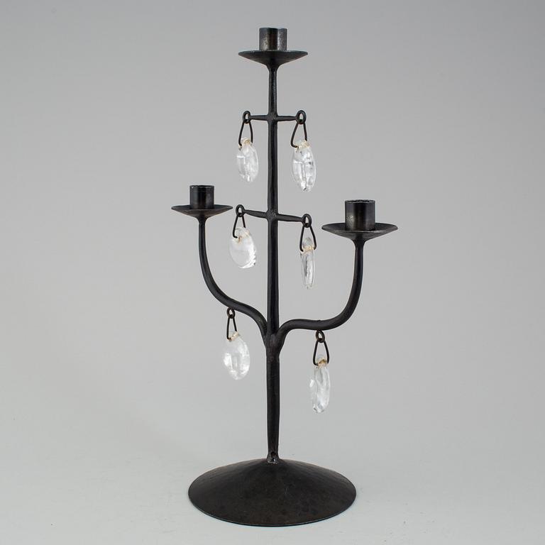 A wrought iron and glass candelabra by Erik Höglund.
