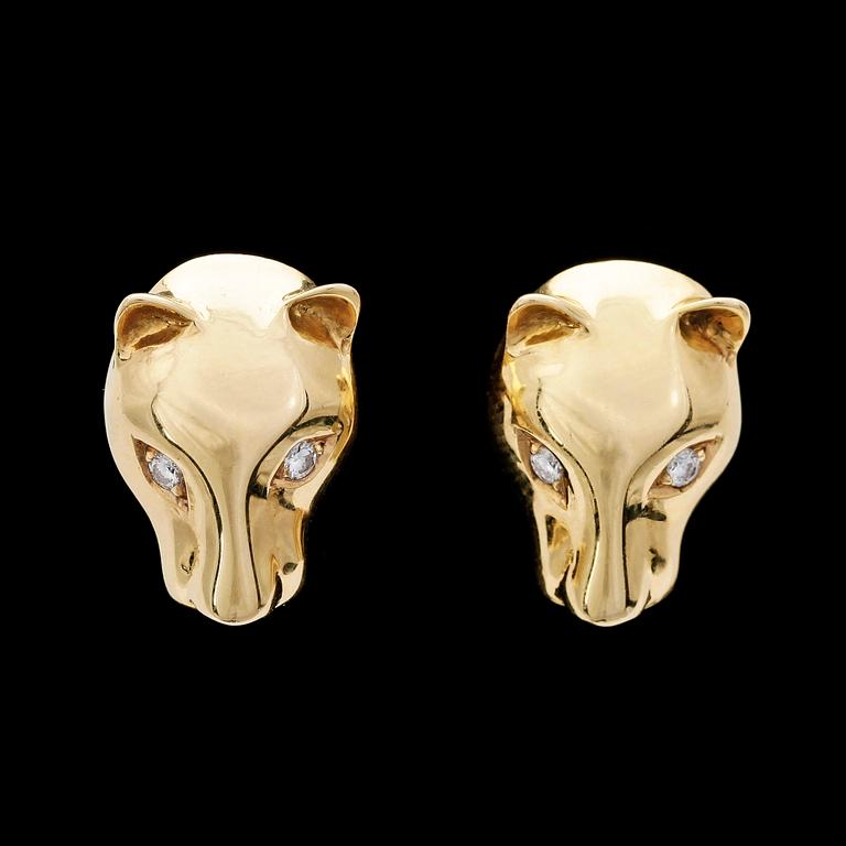 CUFFLINKS, shape of panthers head, gold with brilliant cut diamonds, tot. app. 0.12 ct. Weight 13 g.