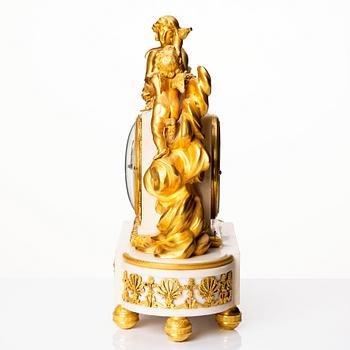 A Louis XVI marble and ormolu mantel clock, late 18th century.