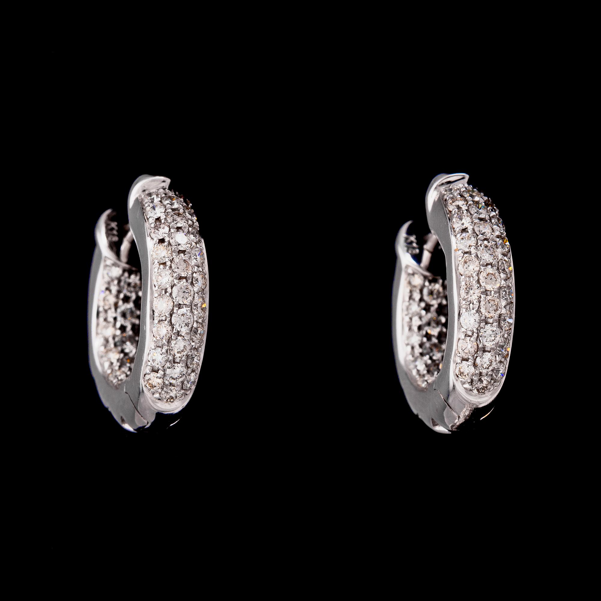 A pair of brilliant cut diamond earrings, tot. 1.11 cts.