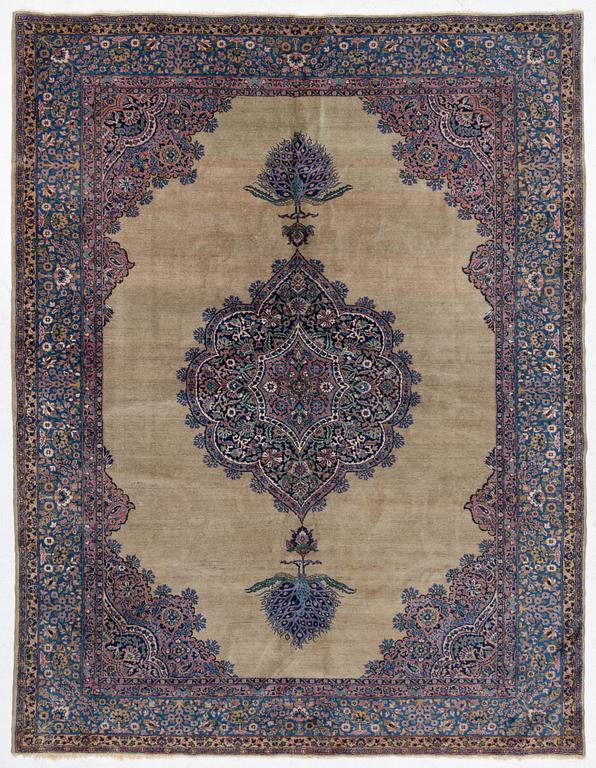 A semi-antique Kerman carpet, figural, c. 371 x 285 cm.