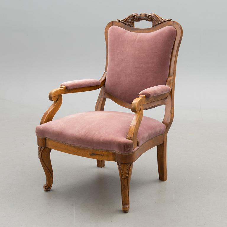 A neo rococo open armchair from around the 1860s.