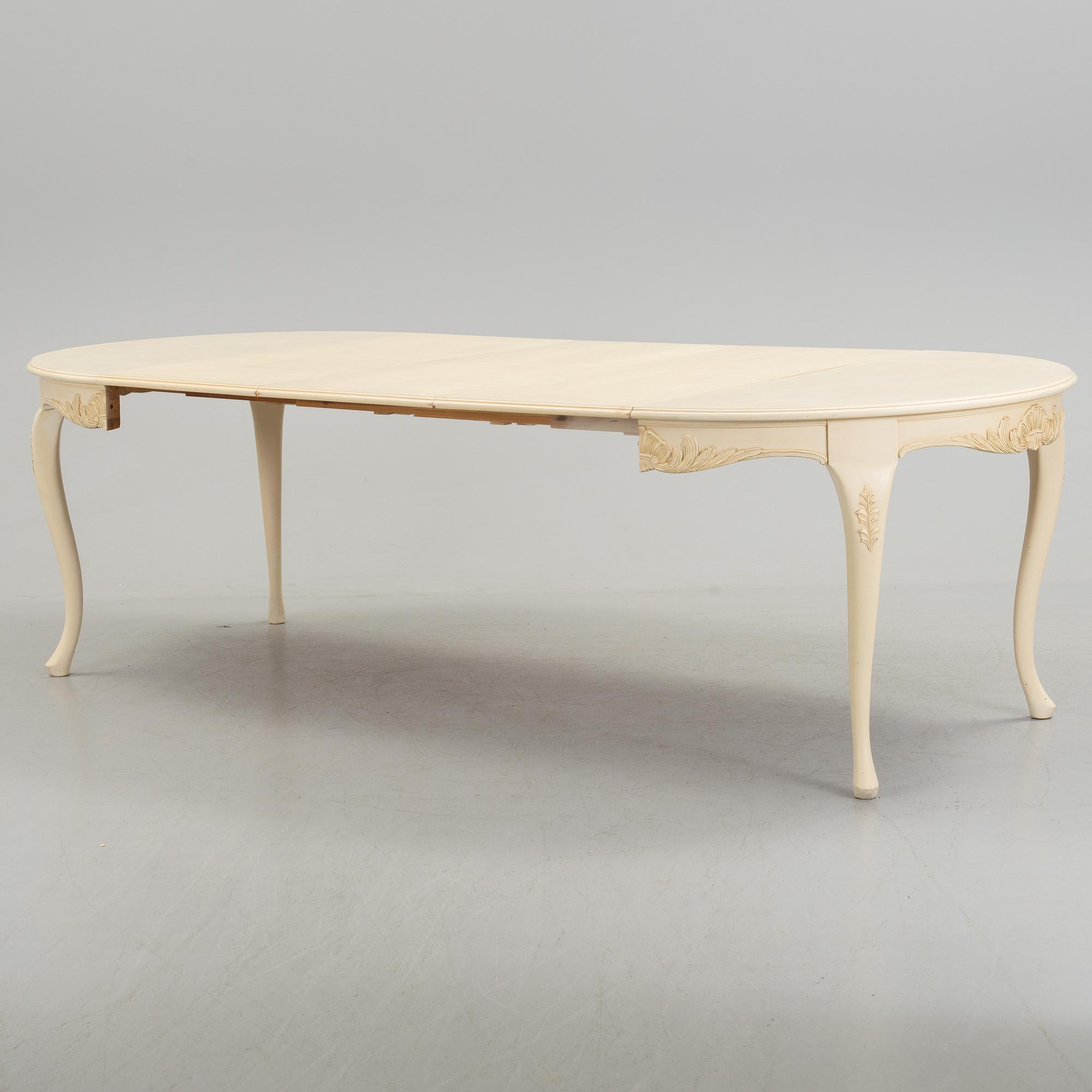 A mid 20th century rococo style dining table.