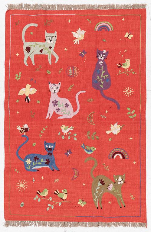 A hand-embroidered Kilim rug, c. 182 x 122 cm.