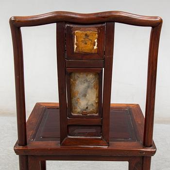A pair of Chinese hardwood armchairs, early 20th century.