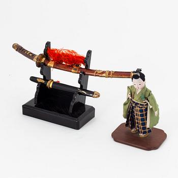 A group of Japanese lacquered objects in wooden crates, early 20th Century.