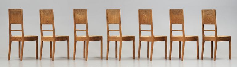 A Art Nouveau oak set with dining table, seven chairs and a side table, Finland, early 1900's.