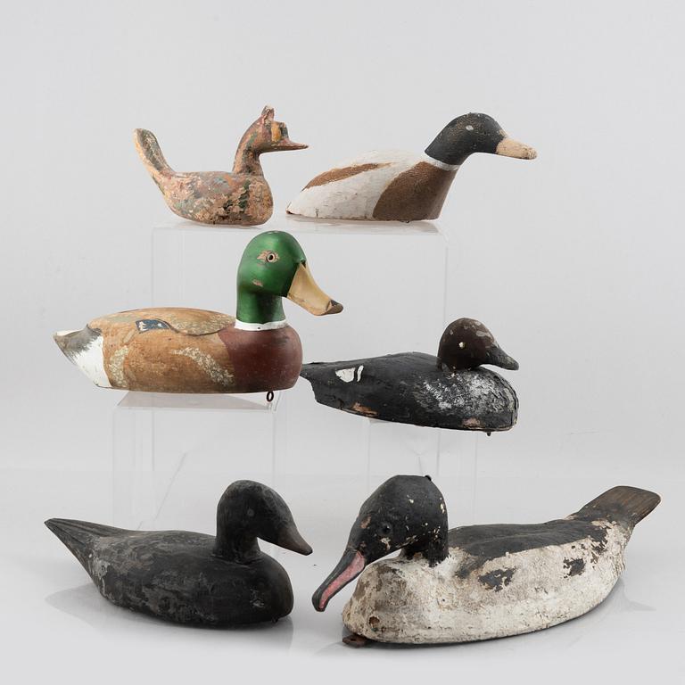A set of six wooden duck decoys, 20th century.