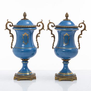 Decorative urns, a pair, porcelain, Sevres-like mark, circa 1900.