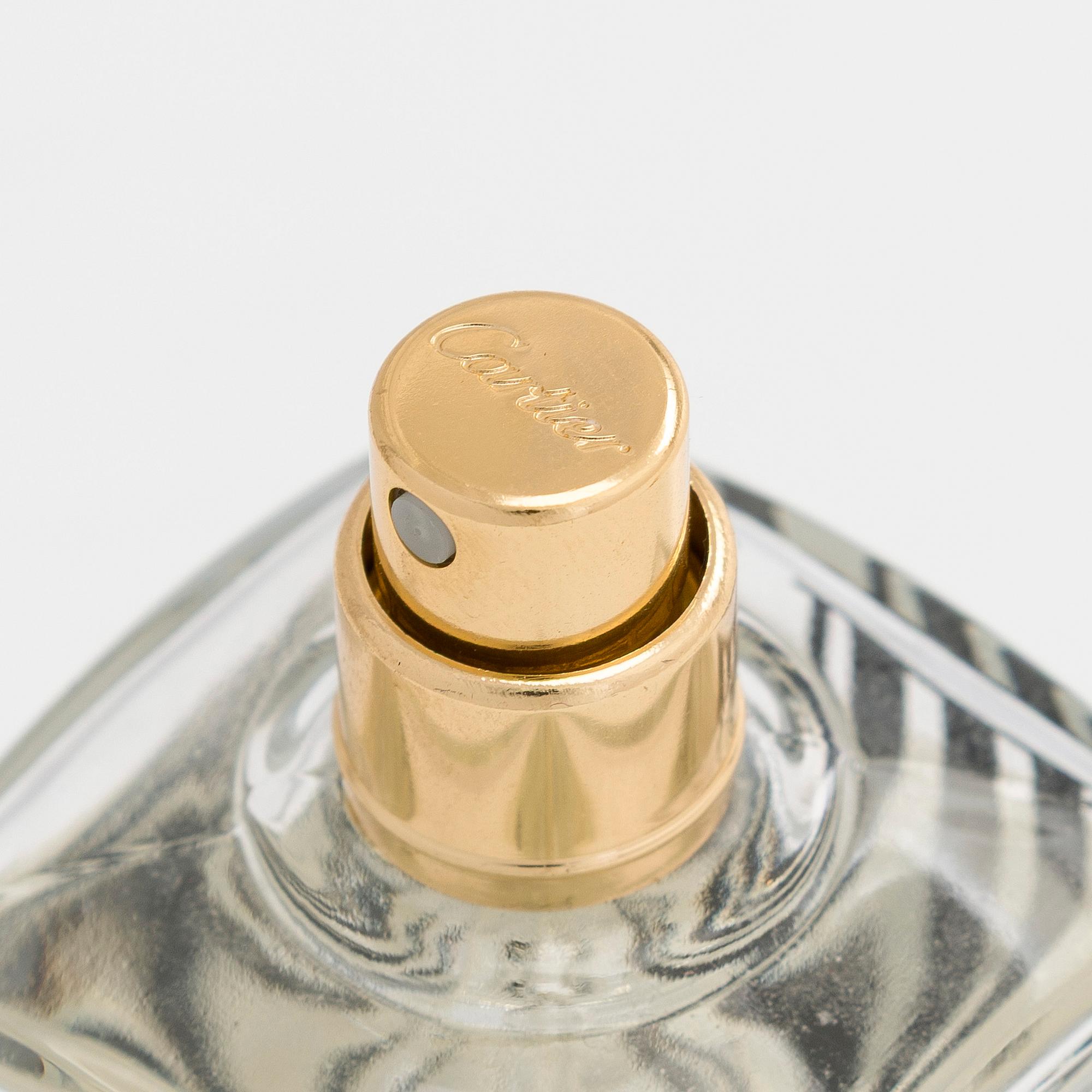 Cartier, parfymfodral med parfymflaska och sminkspegel.