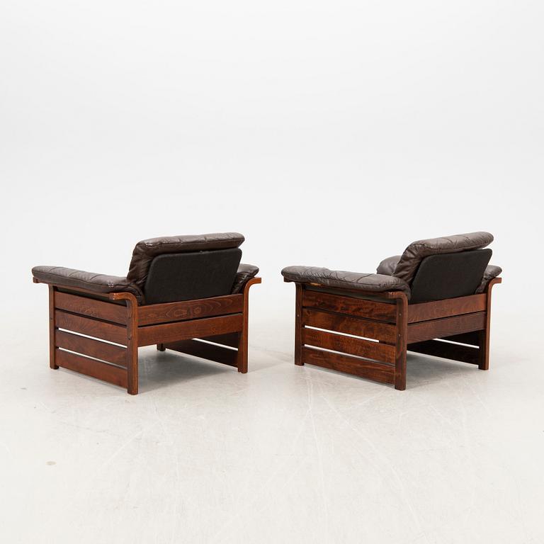 A pair of 1970s leather armchairs.