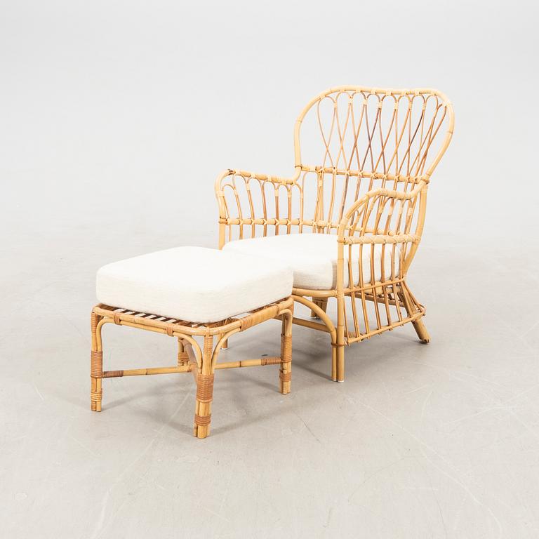 Josef Frank, wicker chair with stool model no. B 311 for Svenskt Tenn, second half of the 20th century.