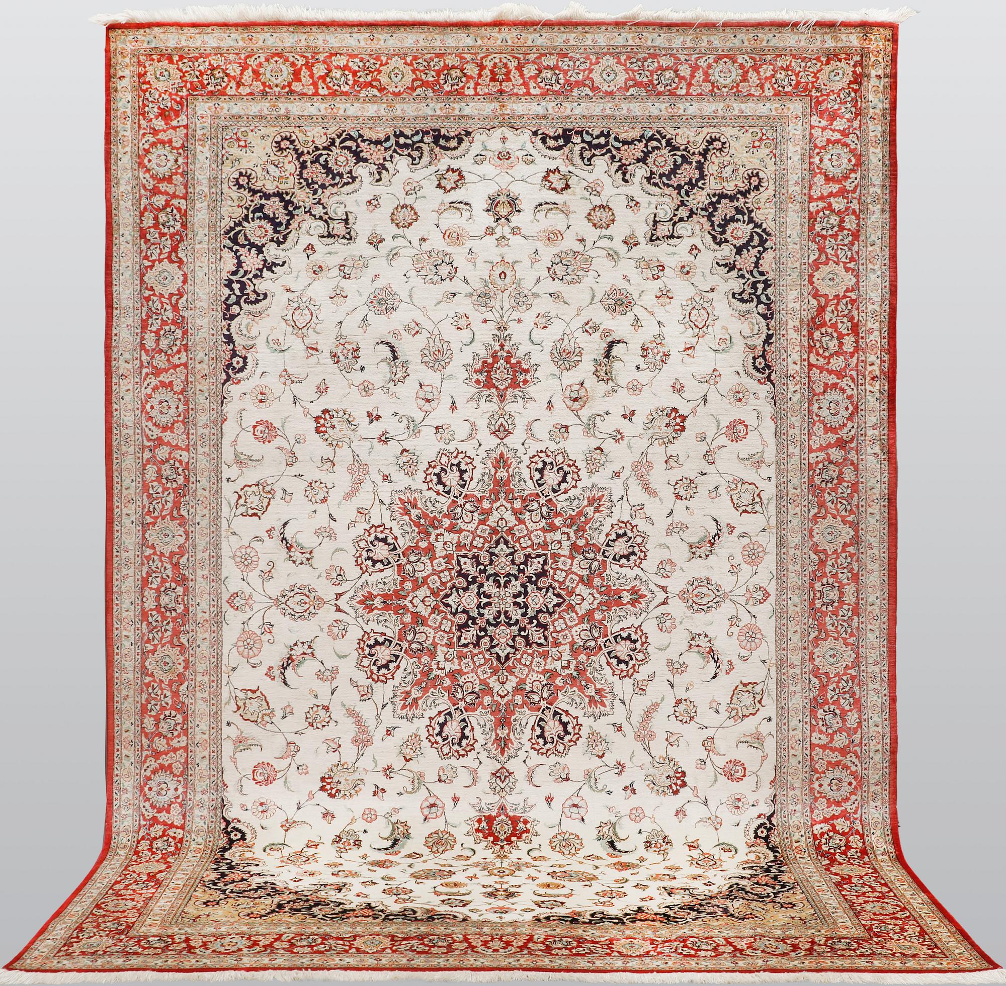 A silk Ghom carpet, 295 x 195 cm.
