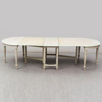 A 19th century dining table in three parts.