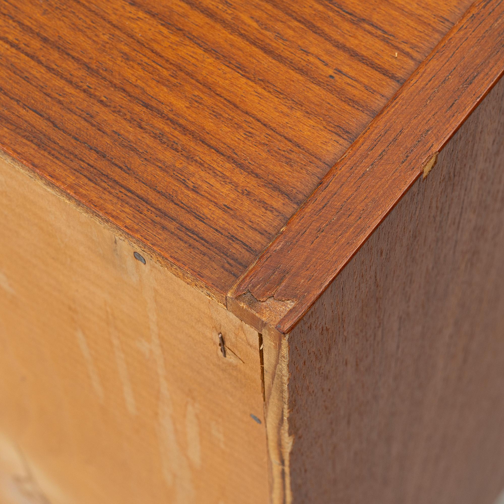 A 1950's teak veneered sideboard.