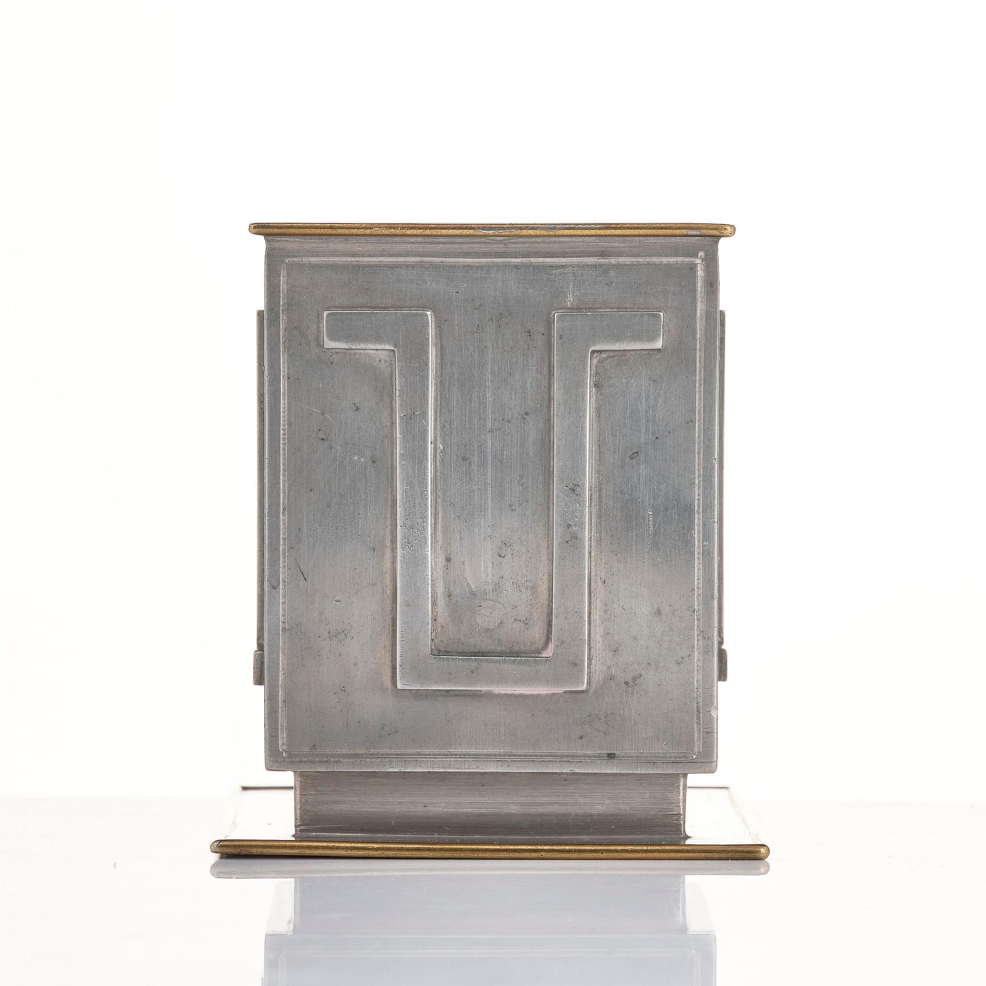 Nils Fougstedt, pennkopp, tenn och mässing, modell A 503, Firma Svenskt Tenn, Stockholm, 1932.