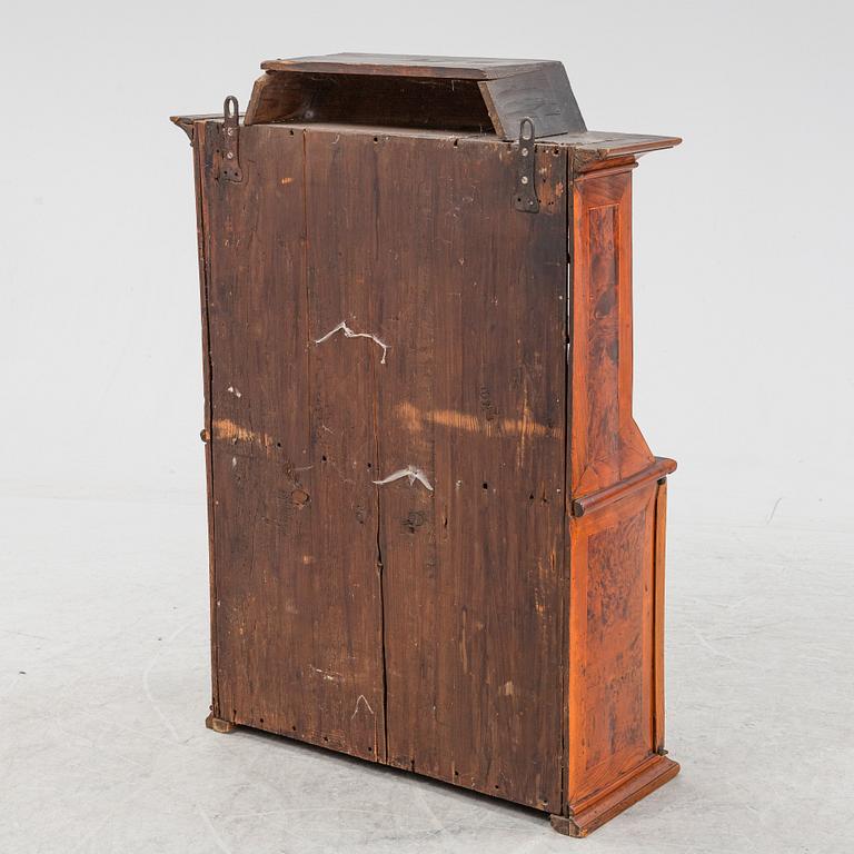 A late Baroque burr alder-veneered cabinet, first part of the 18th Century.