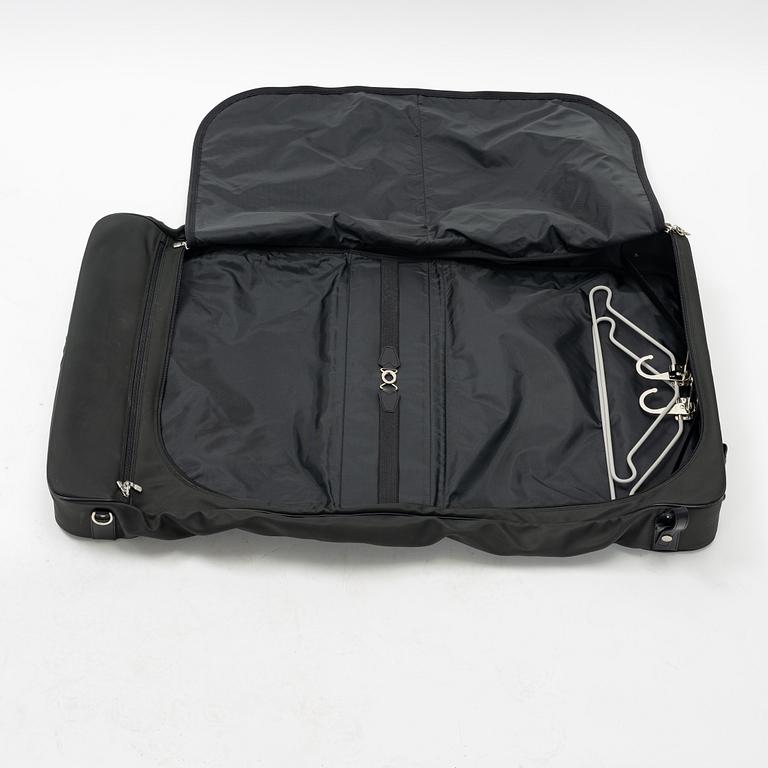 Louis Vuitton, a green canvas and Taiga garment bag.